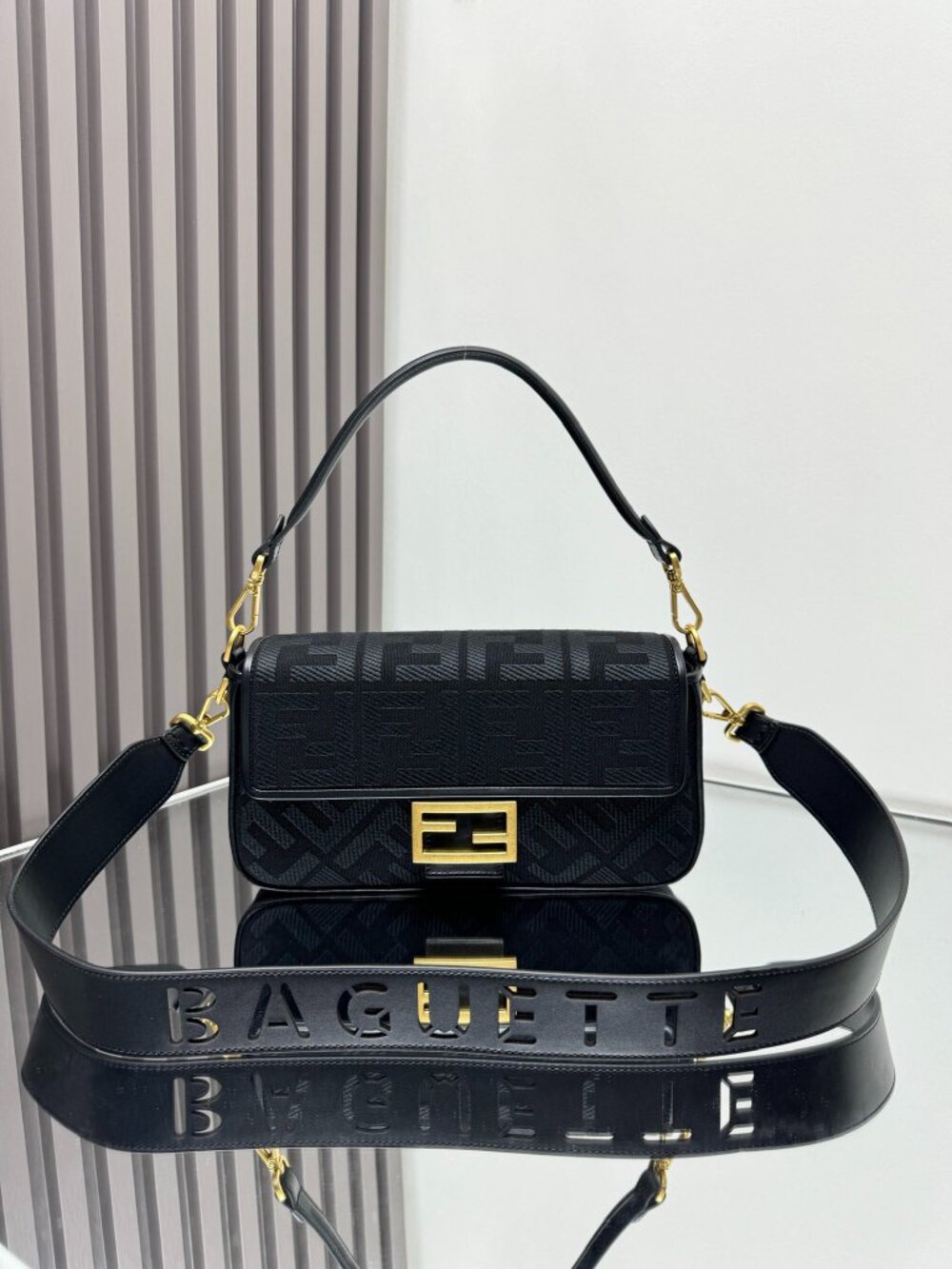 Black Fendi's classic black canvas Baguette baguette bag.